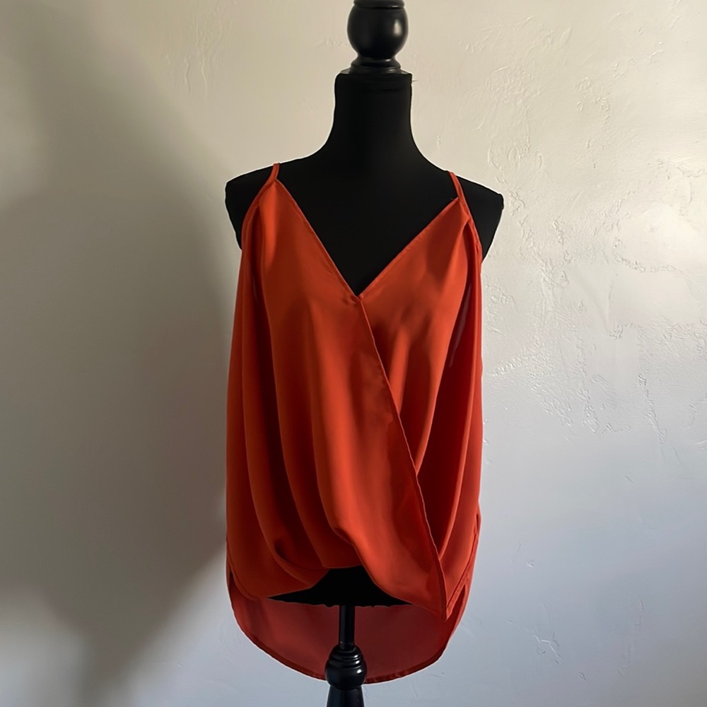 Burnt orange flowy slimming spaghetti strap top.